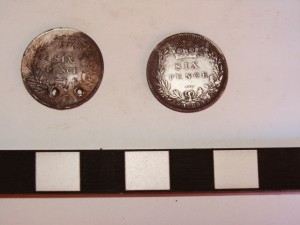 Back side of two sixpence’s excavated at the mess hall at Sabi Bridge Back side of two sixpence’s excavated at the mess hall at Sabi Bridge